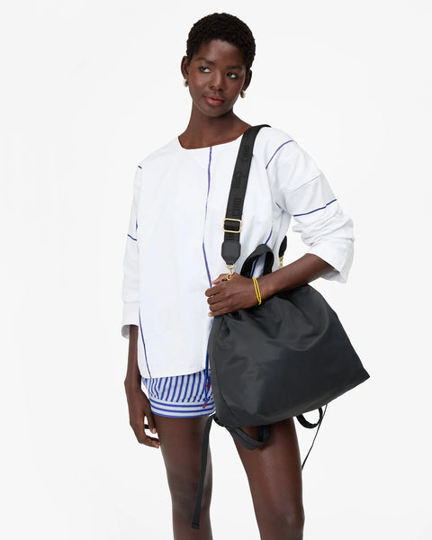 Clare V Sac Tout Black Backpack - Front View Showing Drawstring Closure and Short Top Handles