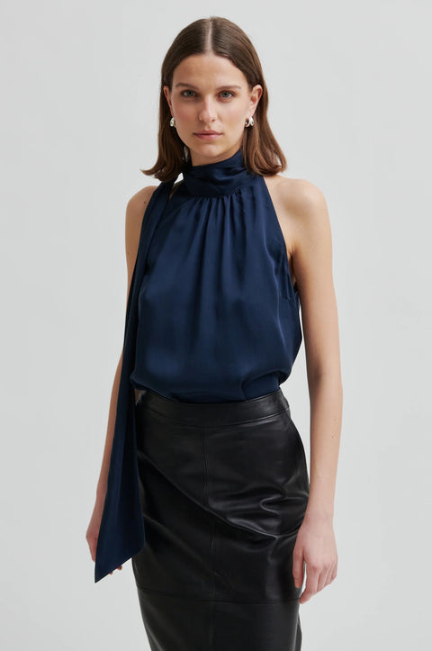 Silky sleeveless blouse in navy blue with the high neck colour with a side tie. Second Female Kura Top