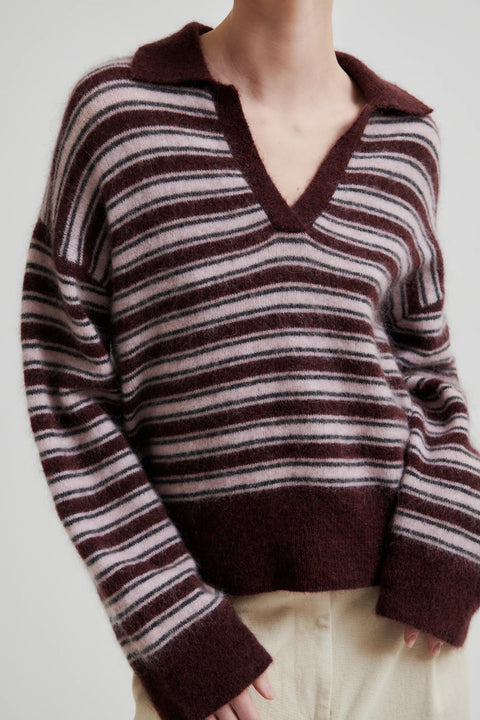 Knit sweater with stripes and a v-neck polo collar. Made of mohair and has a fuzzy texture. Relaxed fit true to size