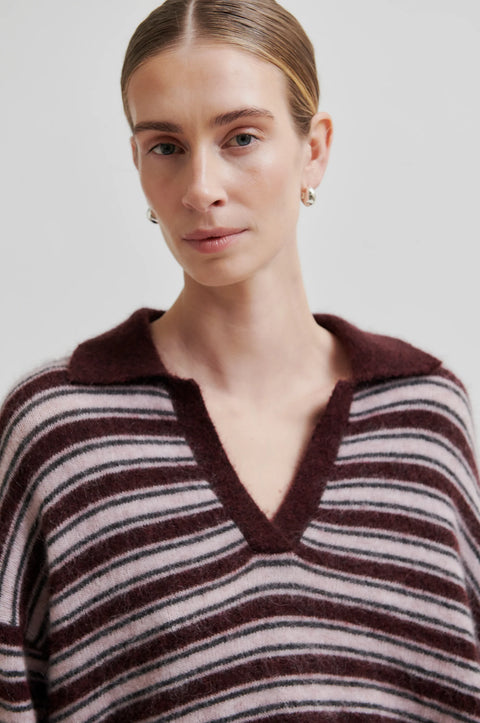 Knit sweater with stripes and a v-neck polo collar. Made of mohair and has a fuzzy texture. Relaxed fit true to size