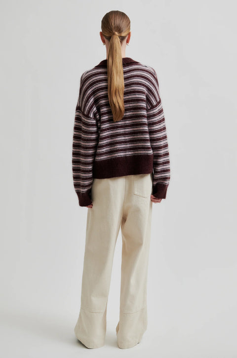Knit sweater with stripes and a v-neck polo collar. Made of mohair and has a fuzzy texture. Relaxed fit true to size