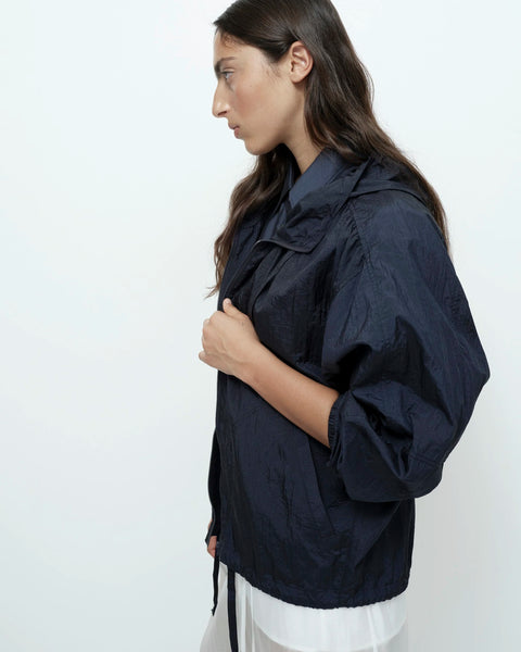Navy anorak jacket side view oversized silhouette drawstring hem