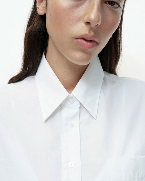 White cotton shirt close up collar and button detail