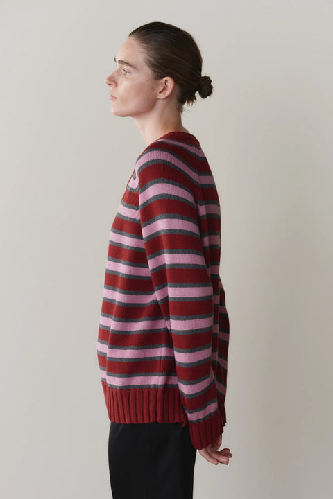 DONNI Cotton Knit Stripe V Neck Sweater - Side View Highlighting Relaxed Silhouette in Oxblood, Rose and Charcoal Stripe
