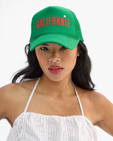 Front view of Clare V green Californie trucker cap – structured snapback hat with 7-hole adjustable closure