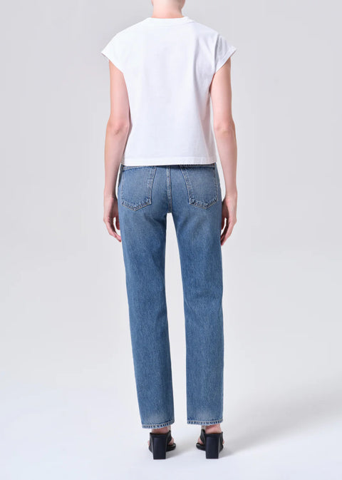 AGOLDE Lana relaxed straight leg jean in Liberty, a medium tinted indigo wash crafted from non-stretch regenerative cotton denim.