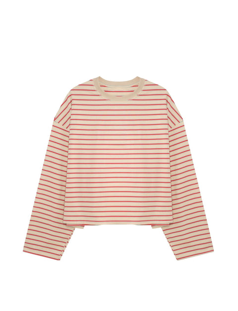 Side view of Apres June cream blue raspberry stripe long sleeve tee showing extra-long rolled sleeve detail