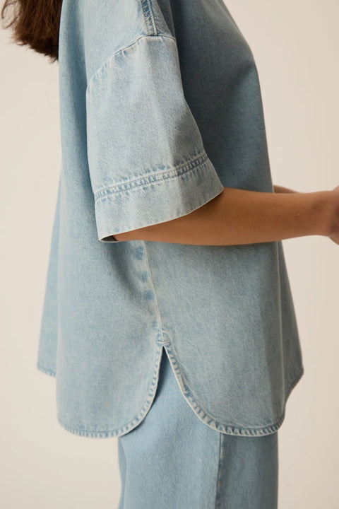 Des Petits Hauts Loris oversized denim t-shirt in bleached blue cotton with a relaxed fit and shirttail hem.