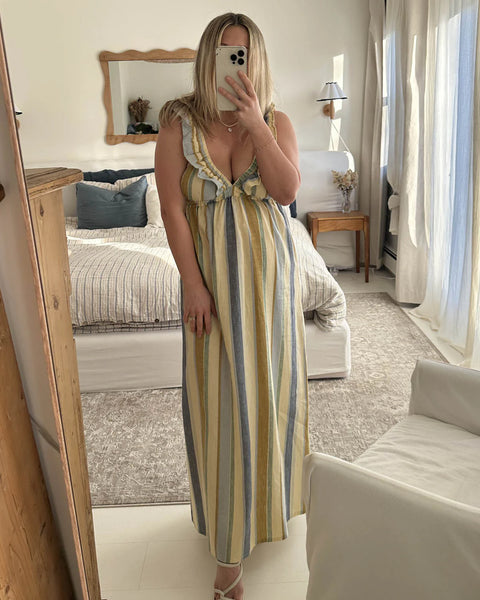 The Milos dress in a linen-cotton blend, featuring a vintage-inspired silhouette with a supportive, stretchy elastic bust designed to be worn braless.