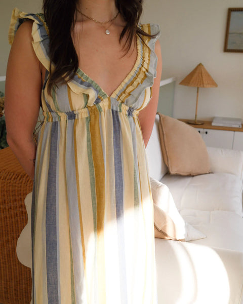 The Milos dress in a linen-cotton blend, featuring a vintage-inspired silhouette with a supportive, stretchy elastic bust designed to be worn braless.