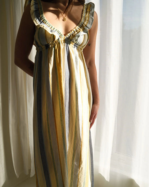 The Milos dress in a linen-cotton blend, featuring a vintage-inspired silhouette with a supportive, stretchy elastic bust designed to be worn braless.