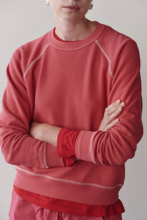 Front view of DONNI raspberry eco terry sweatshirt with creme contrast stitch detail – relaxed fit organic cotton top