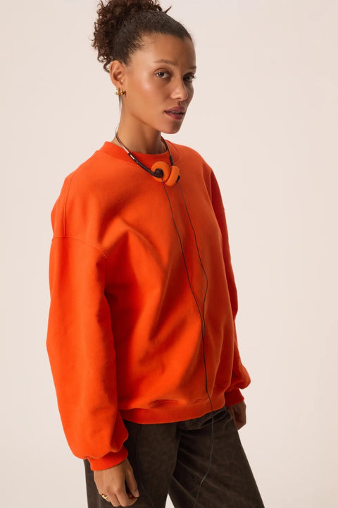 Des Petits Hauts Joeme Sweatshirt in Orange - Close-Up of Cotton Recycled Polyester Fabric and Orange Colour Detail