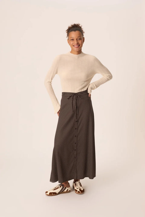 Des Petits Hauts Vanilla Skirt Pois - Side View Highlighting Slightly Flared Midi Length and Fluid Lyocell Viscose Drape