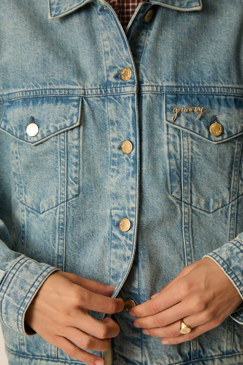 Des Petits Hauts Pompon Pin Groovy - Styled Shot Worn on Jacket Showing Playful Layered Pin Accessory