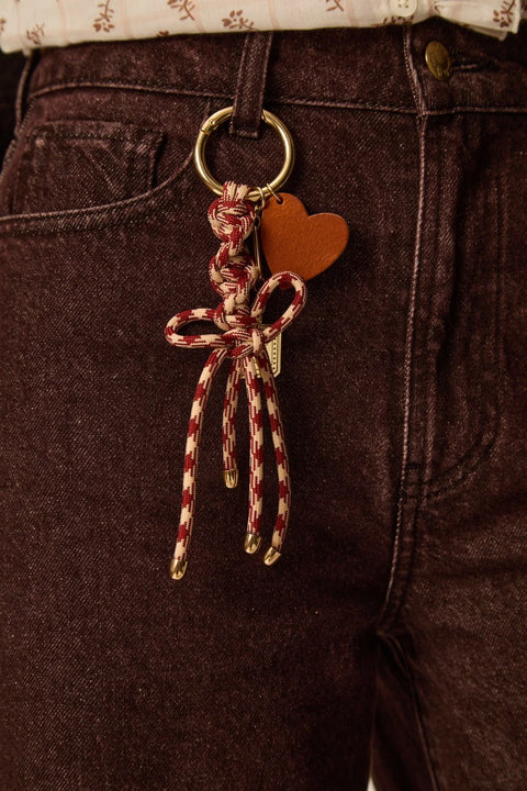 Des Petits Hauts Paddy Bag Charm - Close-Up of Leather and Brass Mix Charm Detail