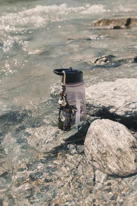 Des Petits Hauts Palma Keyring Charm - Flat Lay Showing Full Charm Design Including Knotted Cord and Stone Pendants