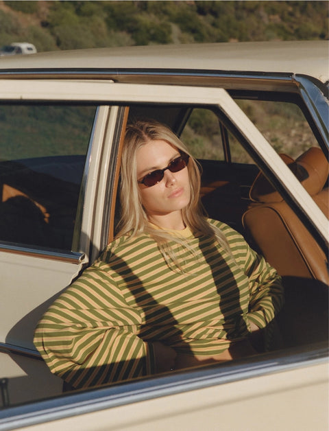 Front view of Apres June melon orange stripe long sleeve tee – easy oversized summer top with rolled sleeve detail