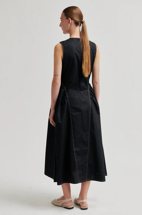 Second Female Larkini Dress Black - Close-Up of Gathered Hip Panel on Smooth Organic Cotton Fabric