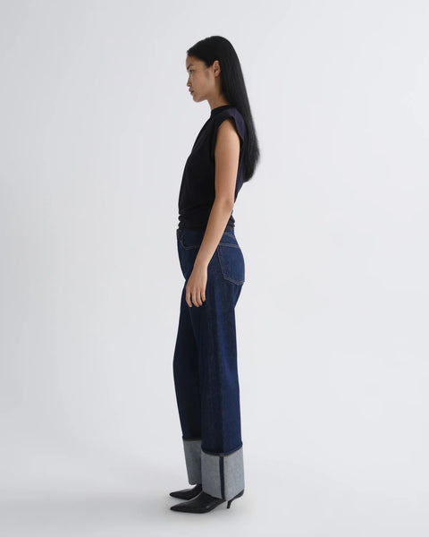 AGOLDE Big Cuff Rinse Jean - Side View Highlighting Sculptural Cuffed Hem and High Rise Waist on Rigid Regenerative Cotton Denim