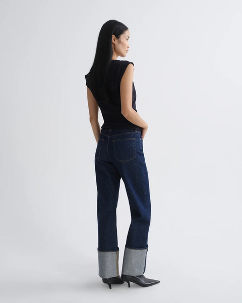 AGOLDE Big Cuff Jean in Rinse - Styled Shot Showing Bold Exaggerated Cuff and Dark Indigo Sustainable Denim