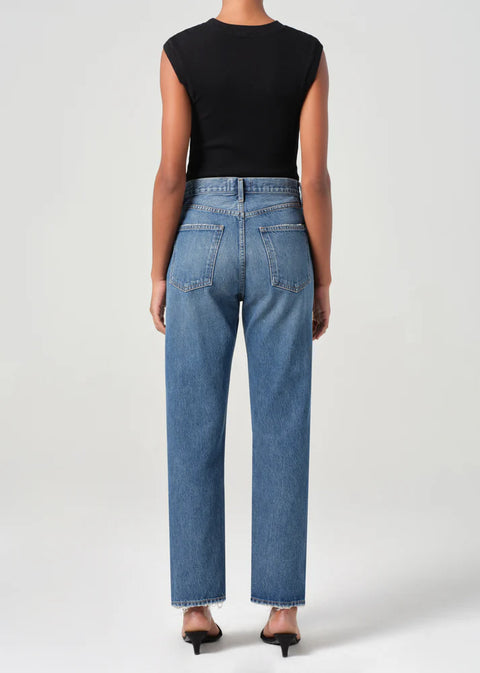 AGOLDE 90s high-rise pinch waist straight jeans in faded indigo on model