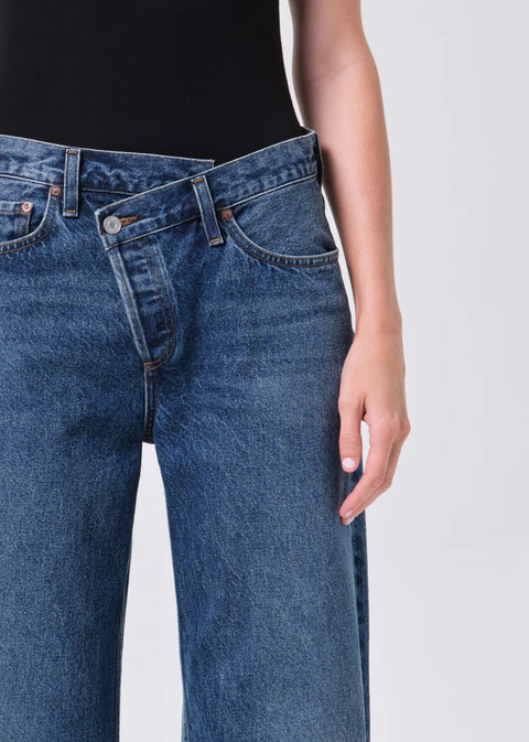 dark indigo denim with criss Cross waistband and curved leg shape
