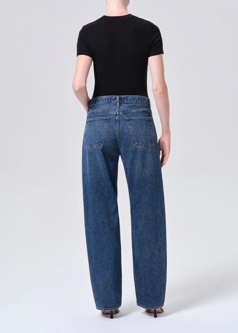 dark indigo denim with criss Cross waistband and curved leg shape
