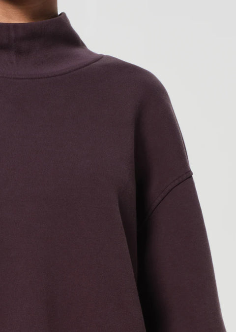 Cotton sweater in deep purple, mock neck, cropped fit with volume puffy sleeve, casual look. Agolde 