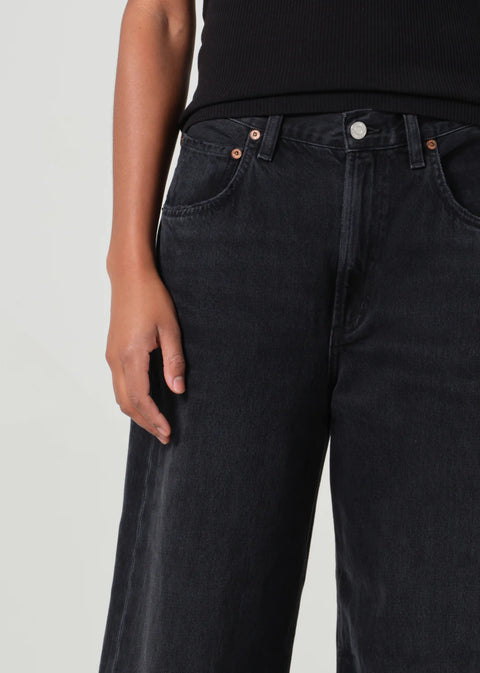 mid-rise fit black denim with a subtle, curved outseam that gently tapers for a flattering silhouette. 
