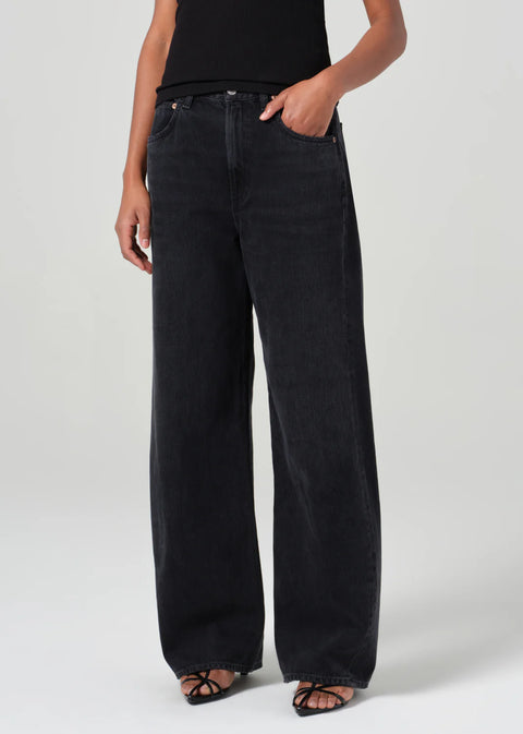 mid-rise fit black denim with a subtle, curved outseam that gently tapers for a flattering silhouette. 
