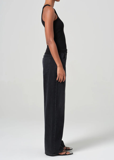 mid-rise fit black denim with a subtle, curved outseam that gently tapers for a flattering silhouette. 
