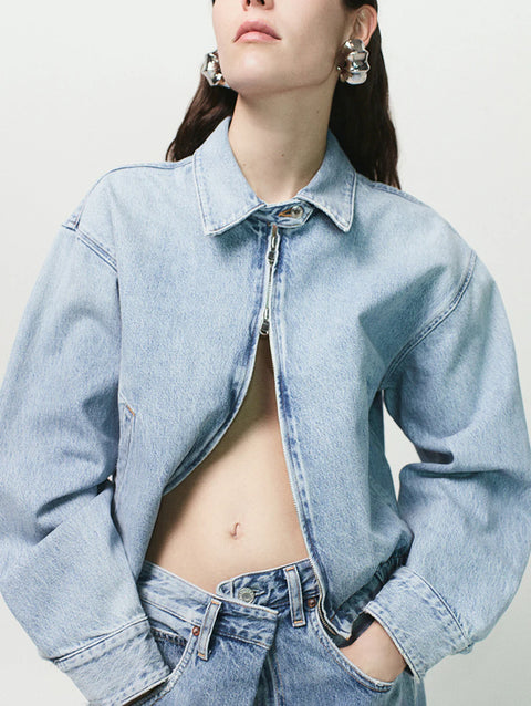 AGOLDE Nile Jacket Space, in a Light blue Wash. Bomber denim jacket, 2 way zipper and neck closure