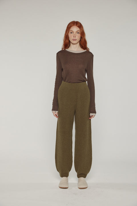 Amente cashmere wool ribbed sweater pants in dark olive on model