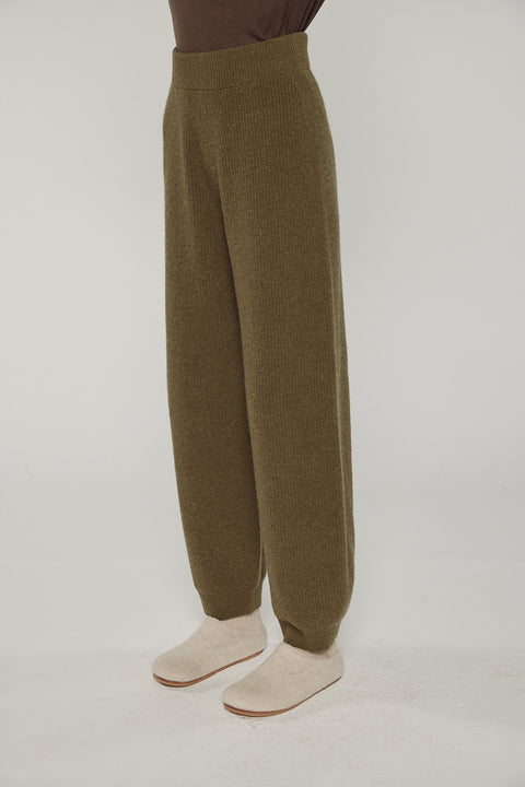 Amente cashmere wool ribbed sweater pants in dark olive on model