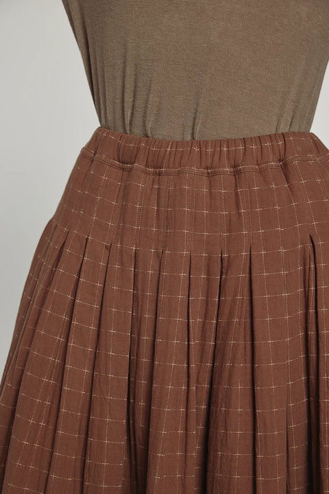 wide-leg pants with tie waist made from cotton linen blend, straight leg fit.  brown and black pattern. Amente Pleated Waist Tie Skirt in Brown
