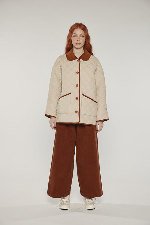 Amente reversible quilted jacket in sand with mocha grid reverse