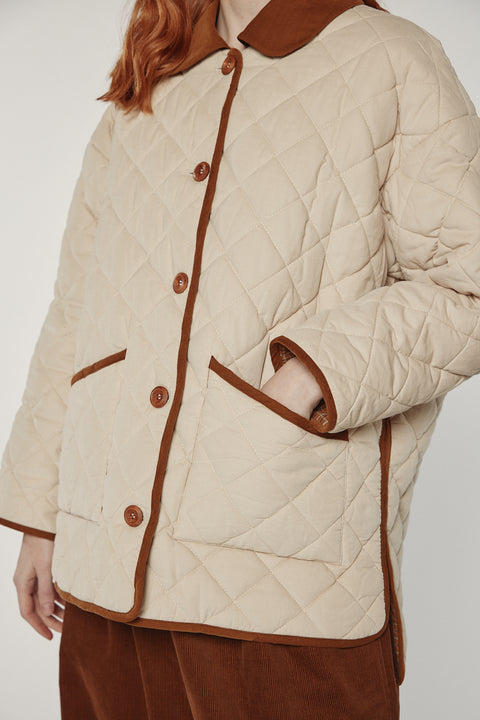Amente reversible quilted jacket in sand with mocha grid reverse