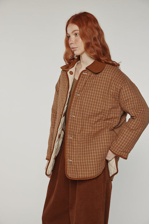 Amente reversible quilted jacket in sand with mocha grid reverse