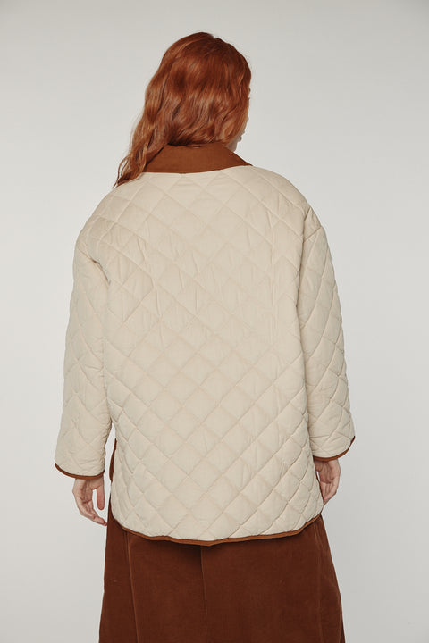 Amente reversible quilted jacket in sand with mocha grid reverse