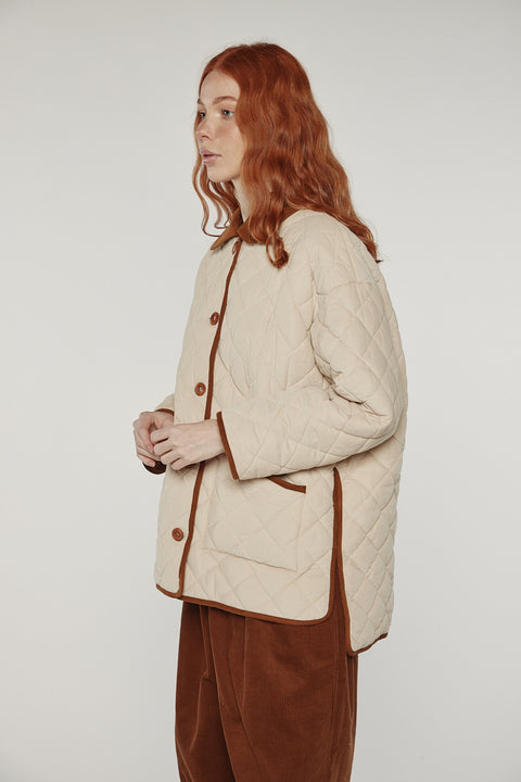 Amente reversible quilted jacket in sand with mocha grid reverse