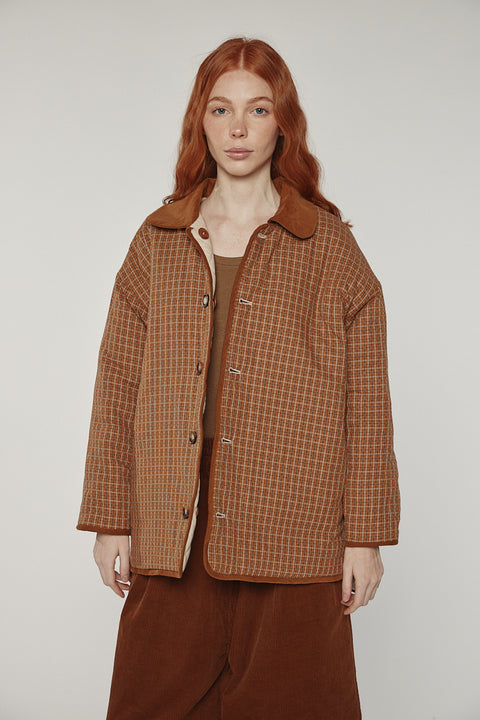 Amente reversible quilted jacket in sand with mocha grid reverse