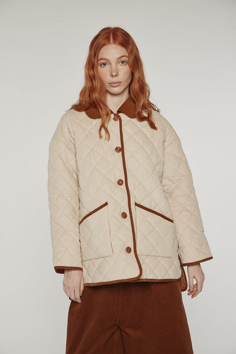 Amente reversible quilted jacket in sand with mocha grid reverse