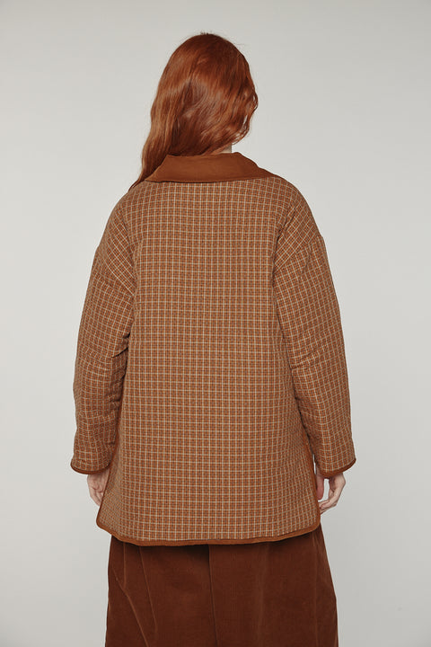 Amente reversible quilted jacket in sand with mocha grid reverse