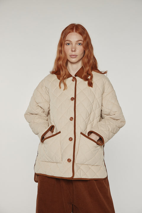 Amente reversible quilted jacket in sand with mocha grid reverse