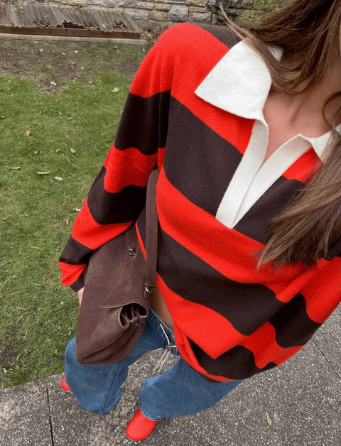 100% cashmere rugby long sleeve shirt with orange and brown stripes and a white collar. 
