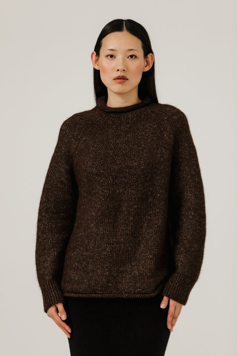 Dark brown sweater, oversized classic fit, made from alpaca and cotton, seamless rollback neckline, brand is Bare Knit
