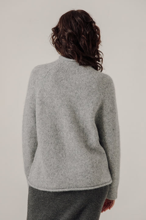 Grey sweater, oversized classic fit, made from alpaca and cotton, seamless rollback neckline, brand is Bare Knit
