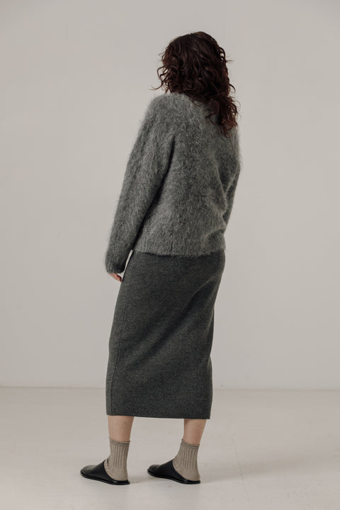V neck cardigan in stone grey, classic boxy fit, light grey buttons. Brand is Bare Knitwear 
