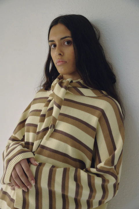 Cotton striped sweater in cream and beige brown, crew neck and ribbed detailing at the collar and cuff.
